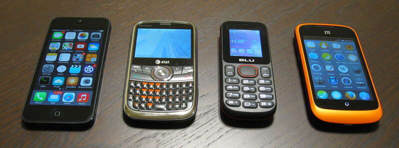 Left: iPhone 5
Sort of left: Pantech P7040 Link, the cheapest unlocked GSM phone available at Best Buy at the time ($45, 2012)
Sort of right: BLU Jenny, the cheapest unlocked GSM phone available at Best Buy at the time ($20, 2013), because I forgot I