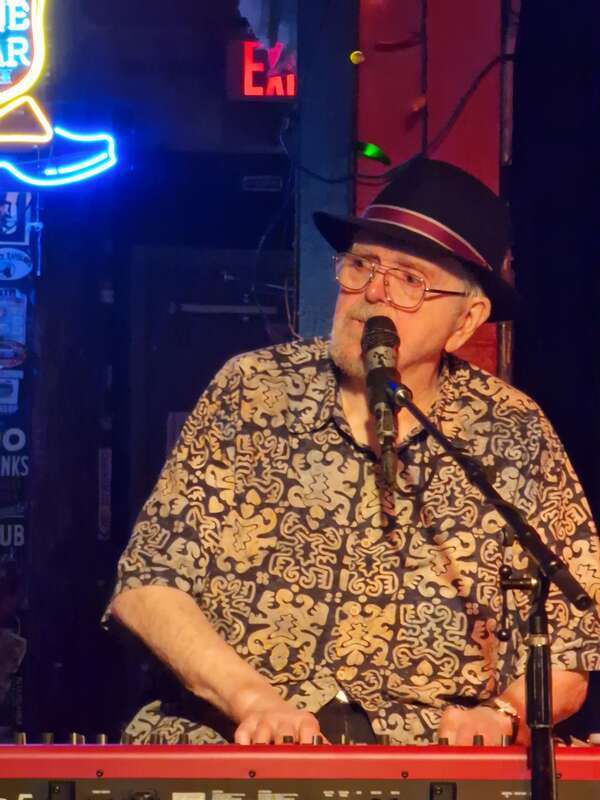 Closeup of Earl Poole Ball performing vocals and keyboard live at the Continental Club in Austin TX, age 83. He is playing a regular Saturday afternoon 3pm slot with one of his bands, Earl Poole Ball &amp; Friends.