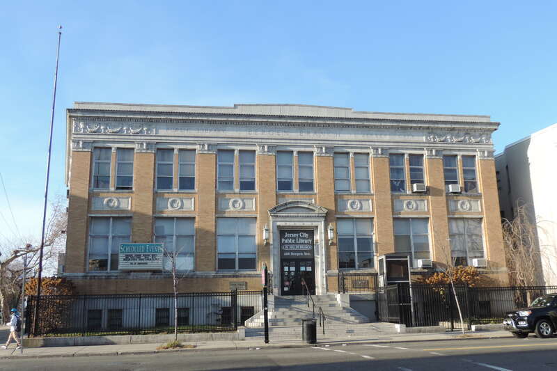 Looking northwest across Bergen Avenue at Miller branch in the Bergen Section on a sunny afternoon