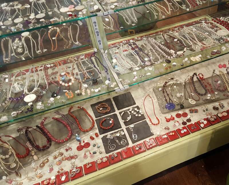 The Capital District Tourism Gnome shops for some jewelry at Elissa Halloran Designs on Lark Street, Albany, New York.