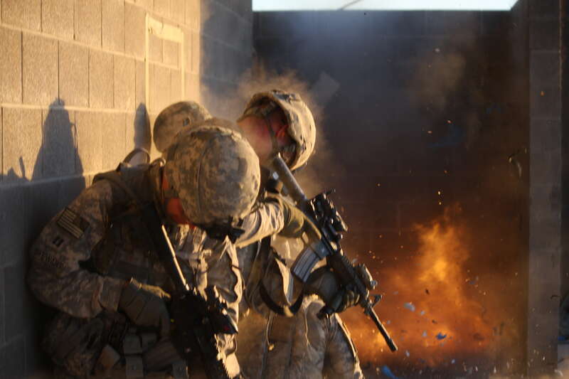Officers of 1st Stryker Brigade Combat Team, "Ready First" 1st Armored Division, participate in an urban combat exercise at a training facility on Fort Bliss, Texas, May 11-12.