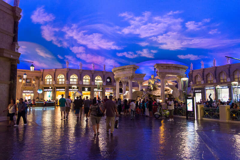 Fountain of the Gods at Caesars Palace (Las Vegas) with stores of Louis Vuitton, Moncler, Giorgio Armani, Gucci, and Salvatore Ferragamo.