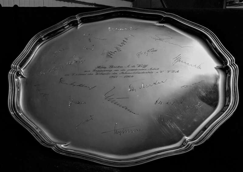 A silver platter, engraved with the signatures of the CEOs and Chairmen of German automobile manufacturers, was presented to Gaston de Wolff in the mid-1960s. The inscription states, in German, "For Mr. Gaston A. de Wolff, in recognition of the