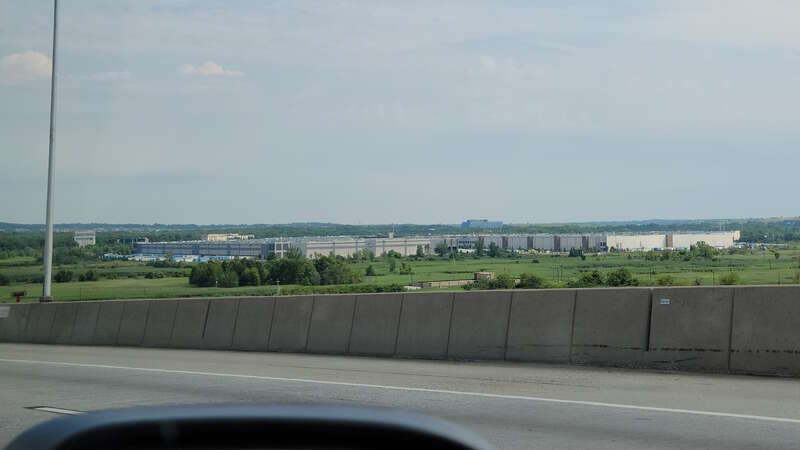 Looking down and southeast from the eastbound span of the New Goethals Bridge at the Matrix Global Logistics Park warehouse complex in Bloomfield on the West Shore of Staten Island. The complex is better known as the Amazon JFK 8 fulfillment center