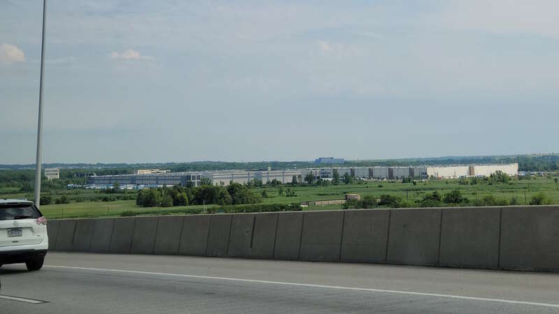 Looking down and southeast from the eastbound span of the New Goethals Bridge at the Matrix Global Logistics Park warehouse complex in Bloomfield on the West Shore of Staten Island. The complex is better known as the Amazon JFK 8 fulfillment center