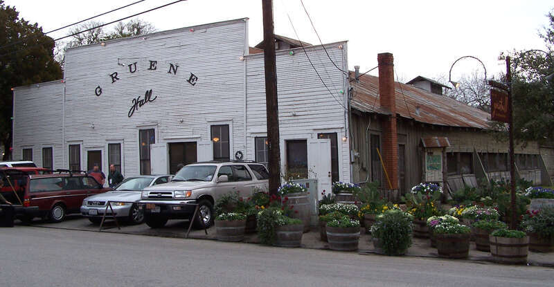 Gruene Hall in Gruene, Texas, United States. Gruene Hall was used as a filming location for the feature film Michael starring John Travolta. The building is part of the Gruene Historic District which was added to the National Register of Historic