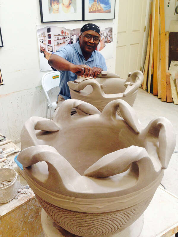 James C. Watkins working in his gallery