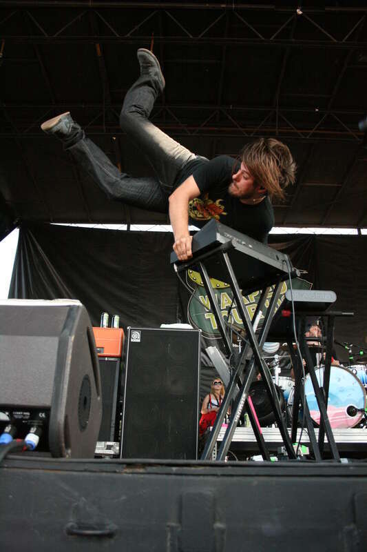 Jesse Johnson, keyboardist for rock group Motion City Soundtrack, performs a "Moogstand" -- a handstand on his Moog synthesizer -- on August 14, 2008.