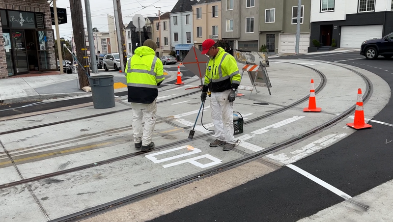 Workers on the L Taraval tracks at 15th Avenue and Taraval in May 2022