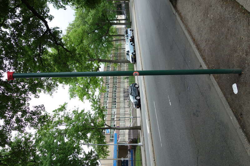 An "empty" bus stop sign pole at the Q20/Q44 bus stop on the west side of Main Street south of 63rd Avenue / Reeves Avenue in Queensboro Hill / Kew Gardens Hills, Flushing, Queens. John Bowne High School is across the street to the east.