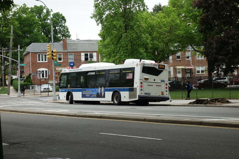 A College Point-bound Q20B bus (currently out-of-service) laying over in front of John Bowne High School at Main Street and Reeves Avenue in Queensboro Hill / Pomonok, Flushing Queens. This bus will become one of the special "school tripper" buses