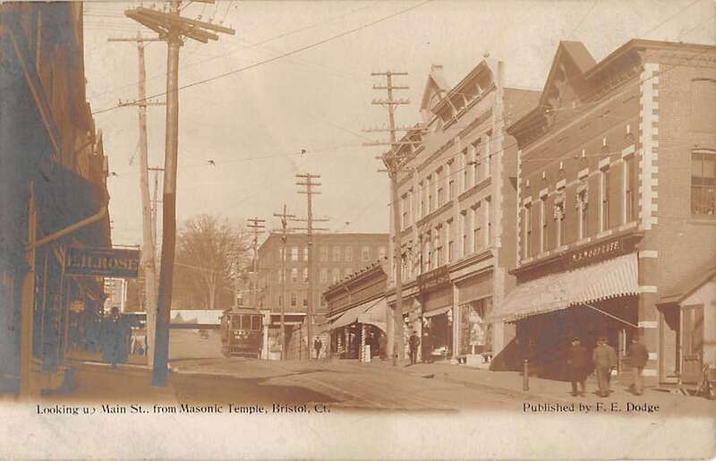 Undivided back postcard of Main Street in Bristol, Connecticut, with a streetcar visible