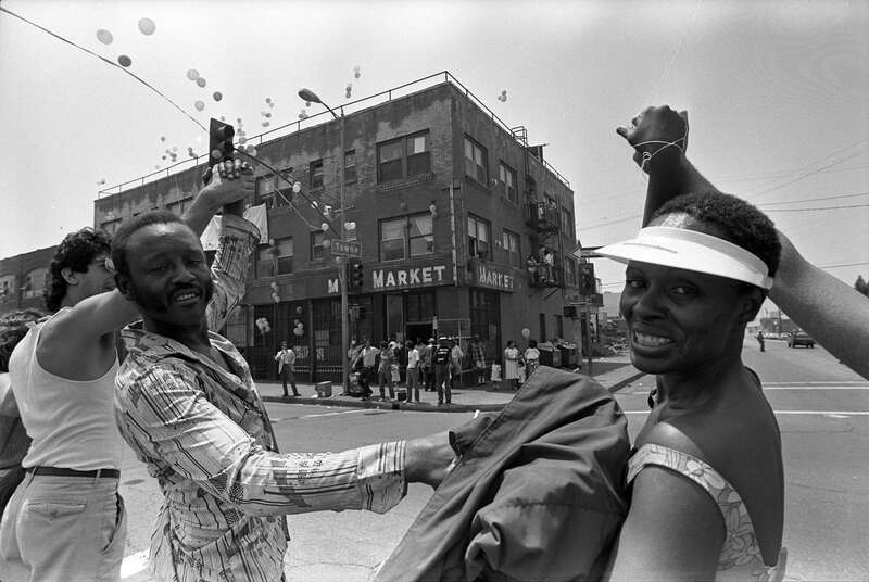 Singer Maria Williams holding hand of Daniel Rias, a homeless man, in East Los Angeles, as part of Hands Across America