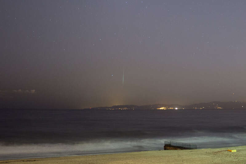 
500px provided description: During the Geminid meteor shower taken at Redondo Beach in Miramar Park looking towards Malibu [#meteor ,#meteor shower ,#geminid]