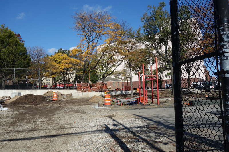 The entrance to the playing courts at the south end of Clement Clarke Moore Homestead Playground, on 45th Avenue between Broadway and 82nd Street in Elmhurst, Queens. The entire park is undergoing a major reconstruction project. Pictured is an adult