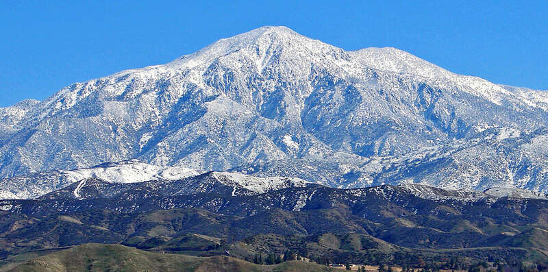 (1 in a multiple picture set)
We sure could use another winter like this one being that we are in a drought.  Conditions were just right this day to capture Mt. San Bernardino completely covered in snow with green grass and palm trees in the