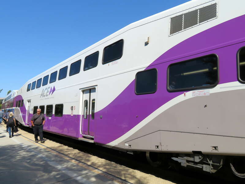 A bilevel car in newer Altamont Corridor Expres livery at Fremont-Centerville station in July 2018