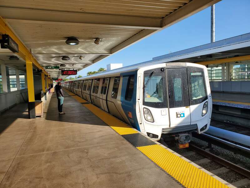 A Daly City-bound Green Line train arriving at Union City station in April 2024
