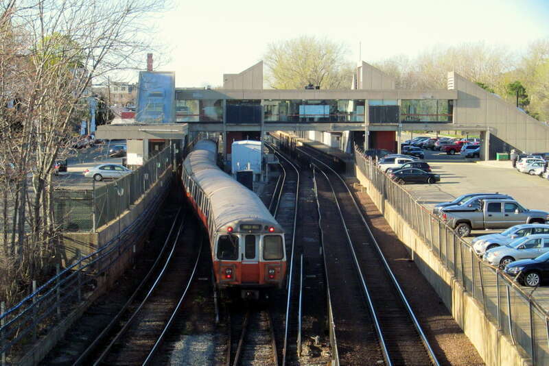 A northbound Orange Line train crosses over when arriving at Oak Grove station in April 2017