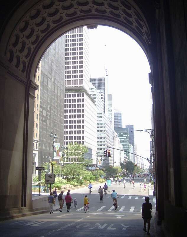 Uptown traffic exits the Park Avenue Viaduct through the eastern portal of the Helmsley Building during "Summer Streets", when seven miles of New York city streets are closed to vehicular traffic.