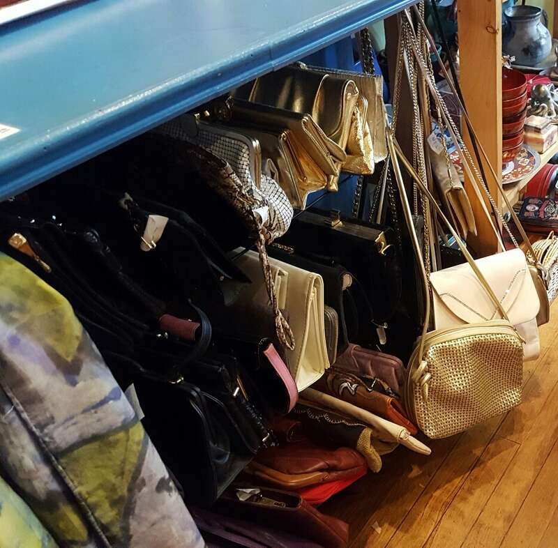 The Capital District Tourism Gnome shops for purses at Elissa Halloran Designs on Lark Street in Albany, New York.