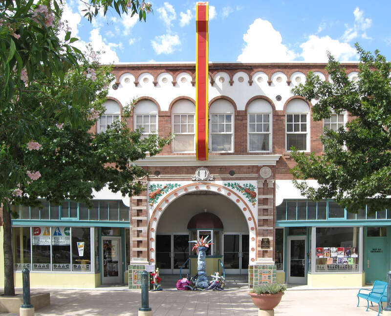 Rio Grande Theatre, a performing arts center located at 211 N. Downtown Mall in Las Cruces, New Mexico. Listed on the National Register of Historic Places, NRIS Item No. 03001352. The items in front of the arch are an installation, "Rag Riparian" by