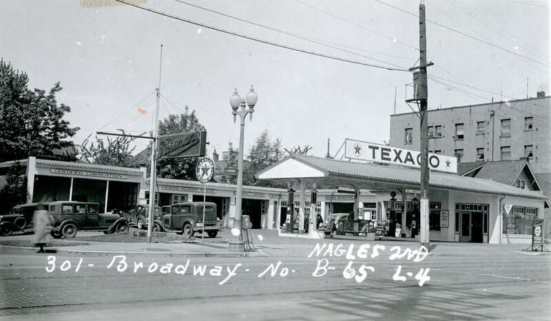 This super service station as at 301 Broadway East (Broadway North at the time) in the Broadway part of Capitol Hill.
It was built as Reardon &amp; Spence, and opened on July 1, 1926. At that time the store sold Standard Oil gasoline. The opening day