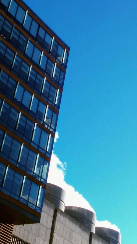 
500px provided description: Smoking Three 1 [#sky ,#city ,#blue ,#geometry ,#buildings ,#urban ,#architecture ,#abstract ,#building ,#smoke ,#curves ,#lines ,#structures ,#building exterior ,#office building]