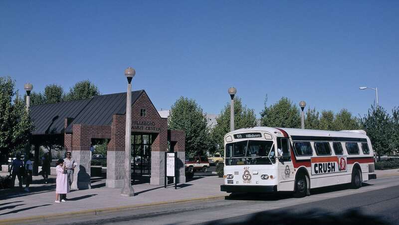 The south end, on Baseline Street, of the first Hillsboro Transit Center of Tri-Met (now TriMet), which was in use from 1988 to 1996 and also included a park-and-ride lot (visible in the background of this view).  Bus 437, a 1973 35-foot Flxible "New
