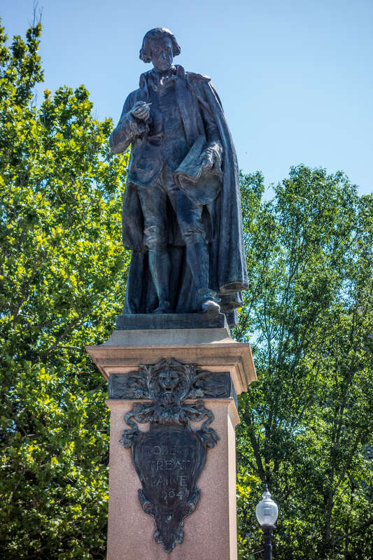 Statue of Robert Treat Paine, Signer of the Declaration of Independence, located at the west end of Church Green, Taunton, Massachusetts; erected in 1904.