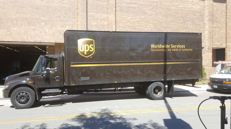 A UPS International Truck parked outside a loading dock at Woodfield Mall in Schaumburg Illinois.