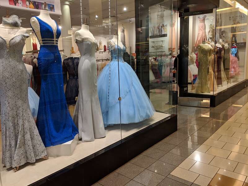 Window display of a prom dress shop