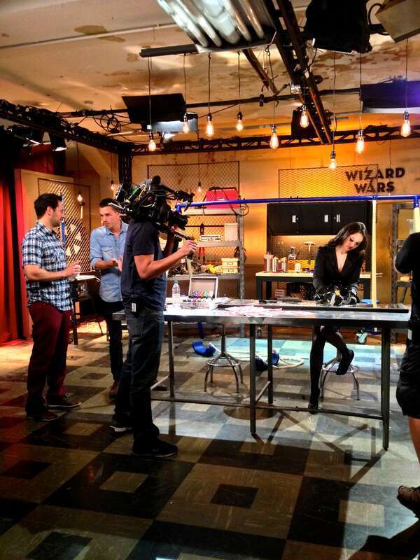 Wizard Angela Funovitz creating in the 'Magic Workshop.' Also pictured: Series creator Rick Lax (far left) and Wizard/series originator Justin Flom (middle).