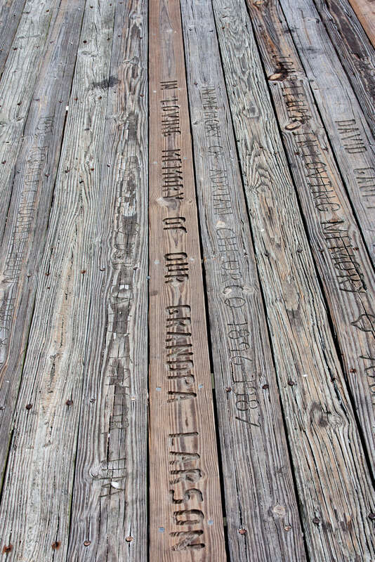 
500px provided description: Wood Carvings At Flagler Beach [#old ,#wood ,#new ,#nails ,#screws ,#carvings ,#messages ,#inscriptions ,#Flagler beach]