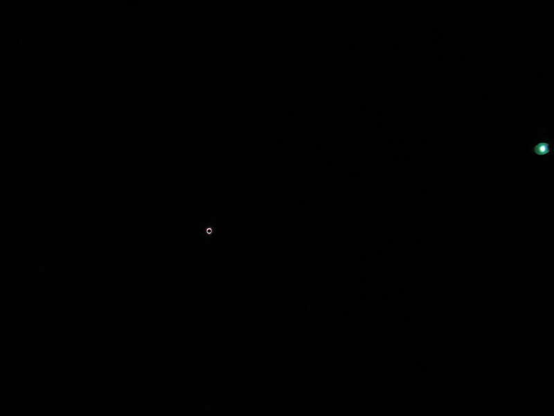 Totality of the Solar eclipse of August 21, 2017 in Falls Park on the Reedy in Greenville, South Carolina, with a streetlamp visible at extreme bottom
