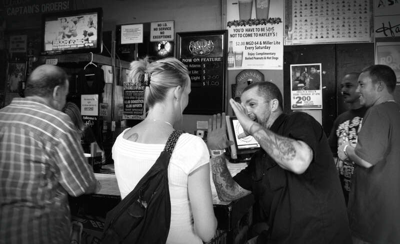 A journey through downtown Mobile Alabama during the 12th Annual Dauphin Street Beer Festival.
I couldn't tell very well, but it appeared that these two patrons were having an animated conversation about tattoos (i think).  Of course, you are free to