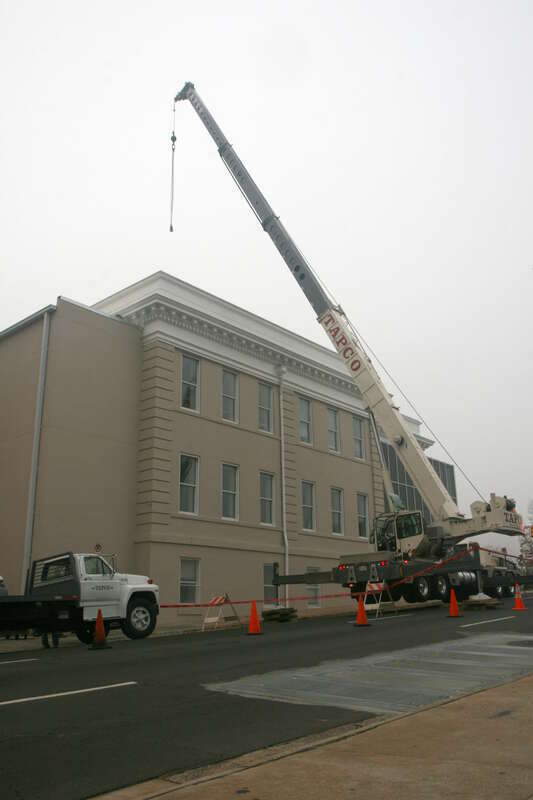 A Terex T 775 hydraulic truck crane operated by TAPCO on West Morgan Street in Durham, North Carolina.