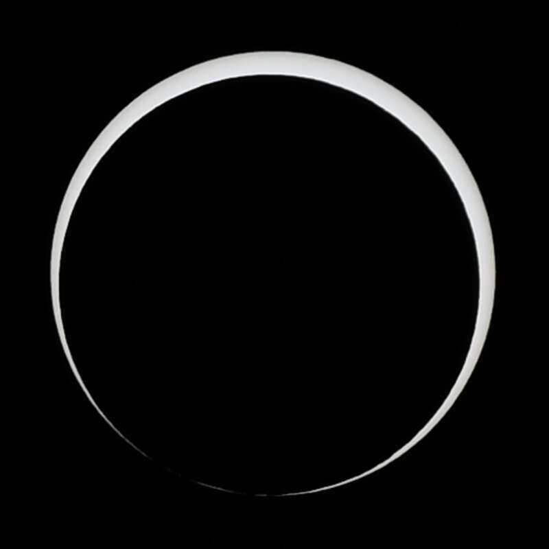 At the end of the full annularity on October 14, 2023, the moon starts breaking through the edge of the sun. Here it is just starting to and the edge of the sun is a broken line. As seen from Petroglyph National Monument in New Mexico, United States