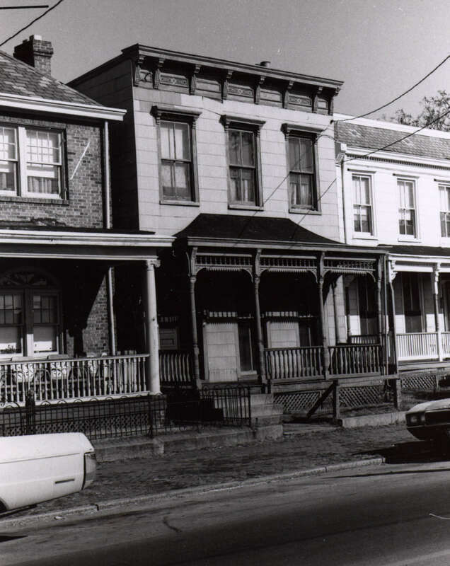 Address/Title: 210 West Leigh Street
Photographer: Zehmer, John G. (John Granderson), 1942-
Original Description (from Book): This wooden house has an elaborate porch in the Eastlake style. All of its wooden trim is intact and the only major