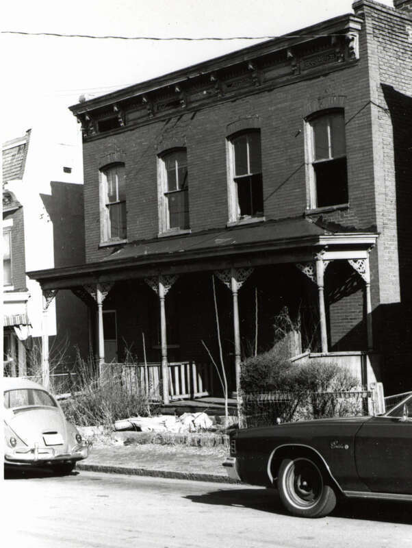 Address/Title: 511 - 513 St. James Street
Photographer: Zehmer, John G. (John Granderson), 1942-
Original Description (from Book): This simple brick double house has a jigsaw porch and cornice.
City/Location: Richmond (Va.)
Date of photograph: ca.