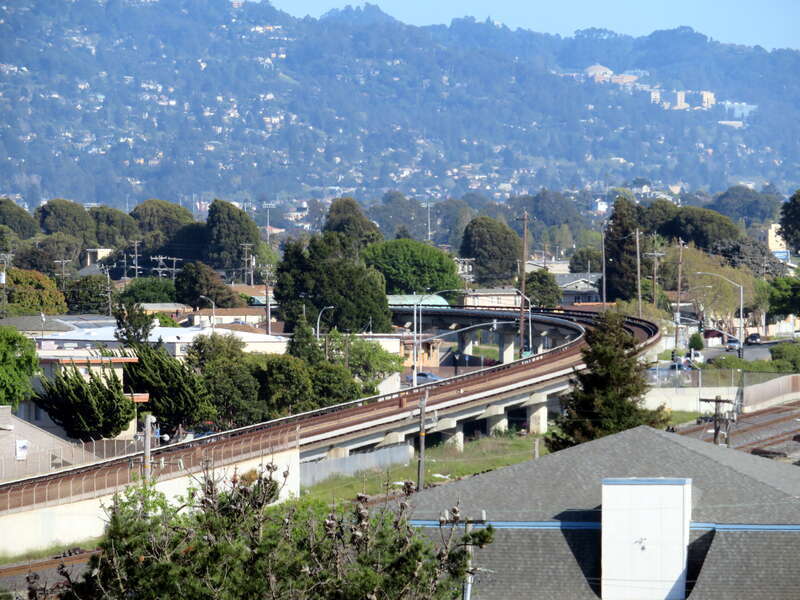 BART flyover in Richmond, which takes it from the Martinez Subdivision to an ax-ATSF line, viewed from the parking garage of Richmond station in April 2018