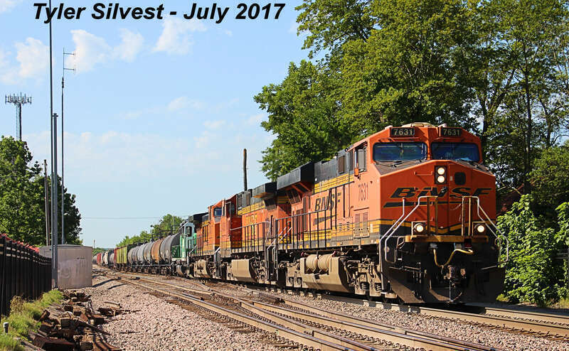 Burlington Northern Santa Fe 7631(ES44DC), 4368(C44-9W), 5228(C44-9W) and 3025(GP40) Leading a Eastbound Manifest on the Emporia Sub near the Loula Street crossing west of Kansas Avenue in Olathe, KS.
Photo Taken: 7-22-17 at 10:12 am

Picture ID#