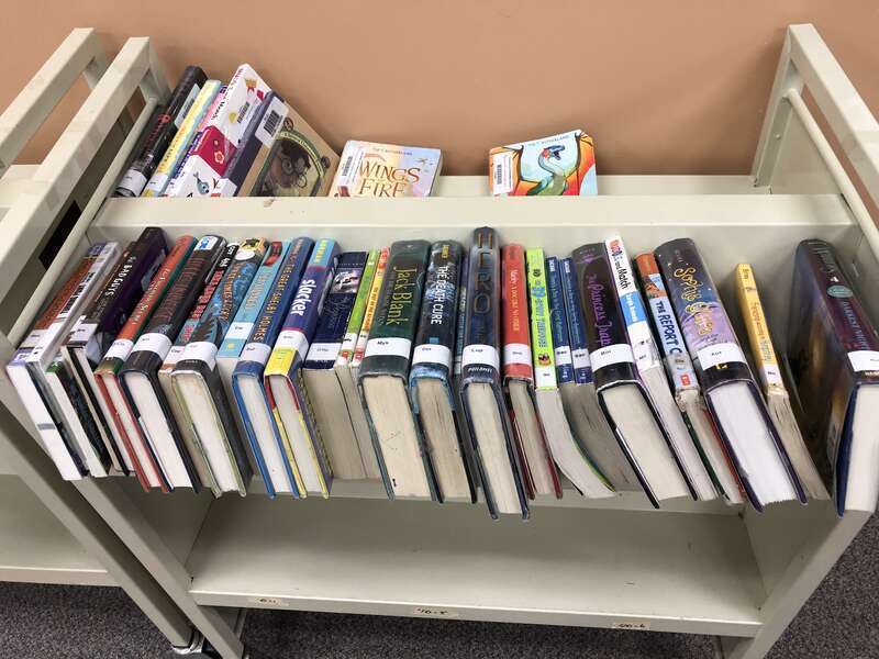 Books on a library cart
