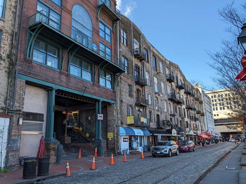Several buildings facing River Street in Savannah, Georgia, including the "rear" of the Savannah Cotton Exchange (far left)