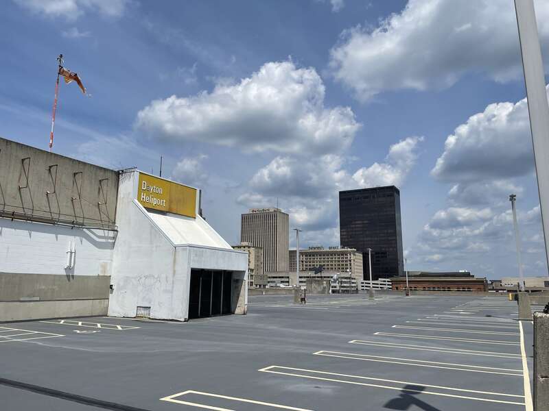 Unused terminal for the downtown Dayton heliport in summer 2022. Terminal is currently unused and abandoned. Landing pad and terminal office are located on top of the Oregon district garage.
