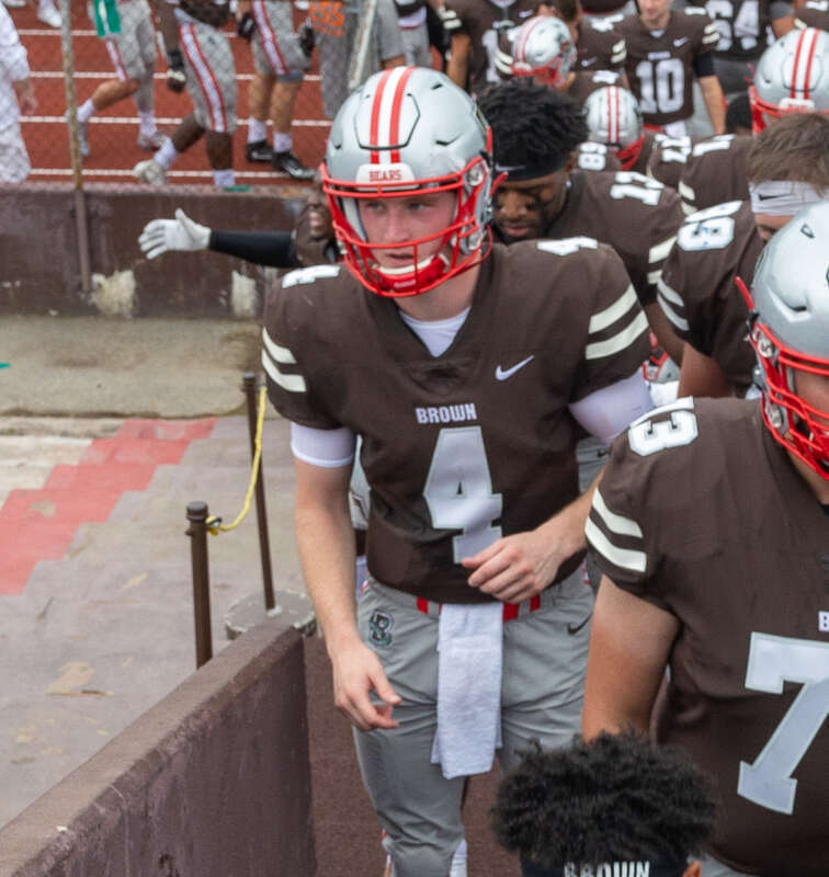 The Brown Bears football team files off the field at halftime, led by no. 39, Allen Smith. Brown Football vs. URI, 18 September 2021.