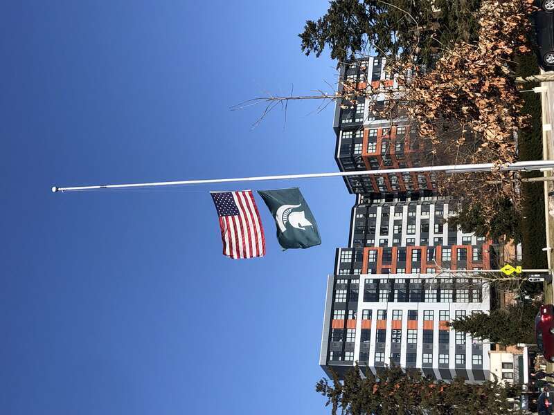 US and MSU flags at half mast after the 2023 Michigan State University shooting