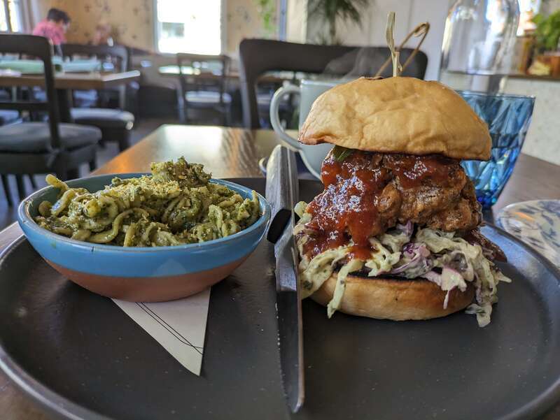 Vegan food from Blossom and Root Kitchen in Danville, California, United States. A Funghi Sando on the right and pasta salad on the left.