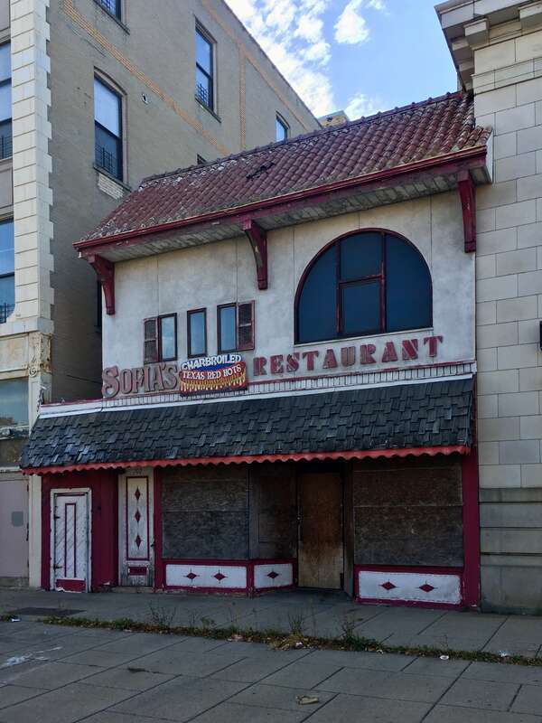 The building at 702 Fillmore Avenue, Buffalo, October 2019. Its most recent former tenant was Sofia's Restaurant (1989-prior to 2007); other previous ones include C&amp;C Restaurant (1964-1989), Red Scissors Premium Store (as of the early 1960s), the