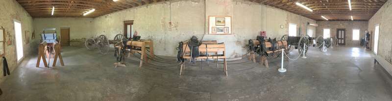 Interior of the Enlisted Barracks 2, containing wagon equipment.
